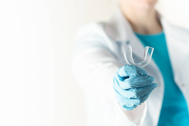 dental tray for dental treatment in the hands of an orthodontist